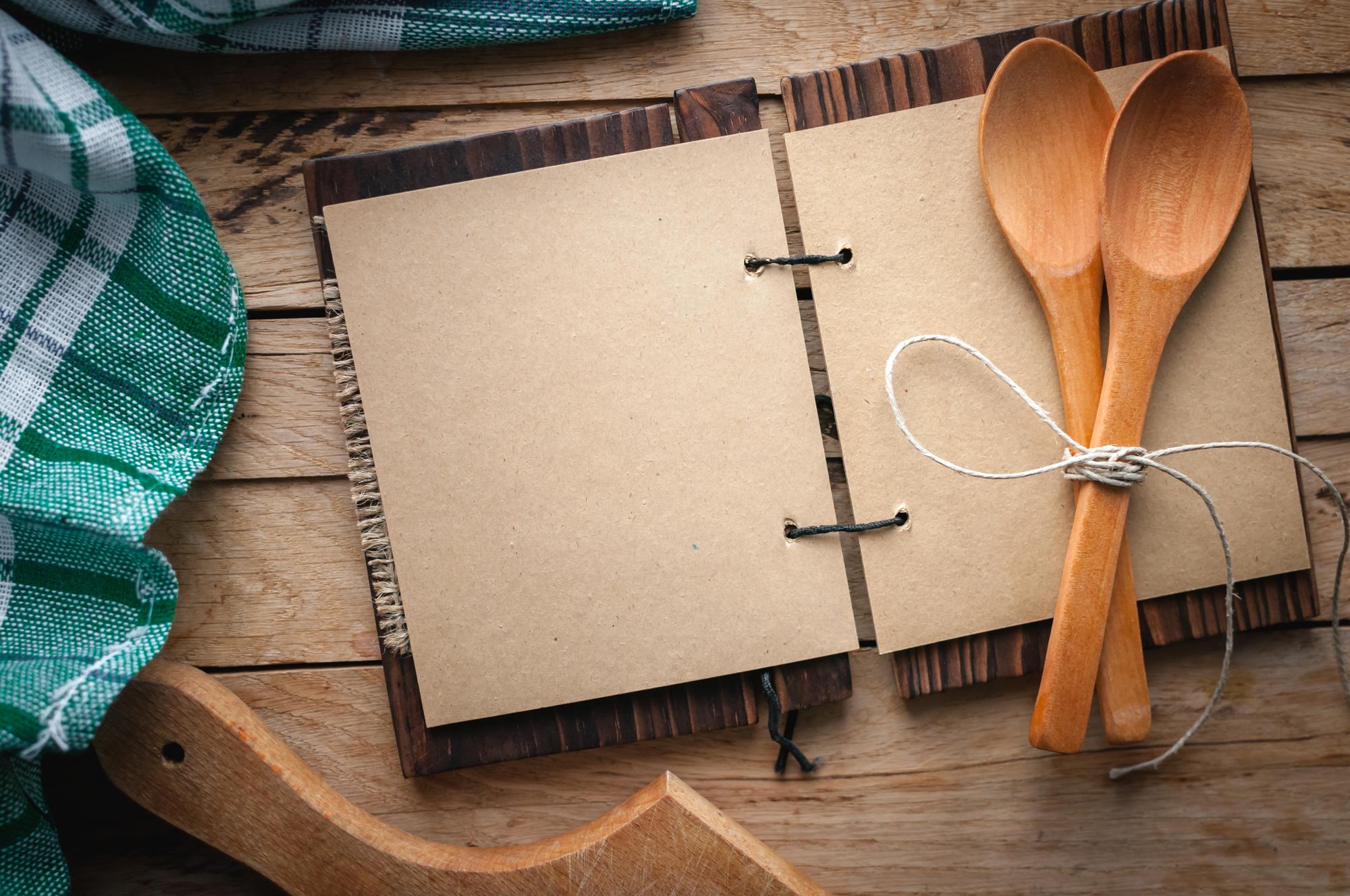A flatlay of recipe cards and utensils